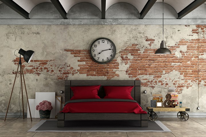 industrial bedroom exposed brick wall red bedding