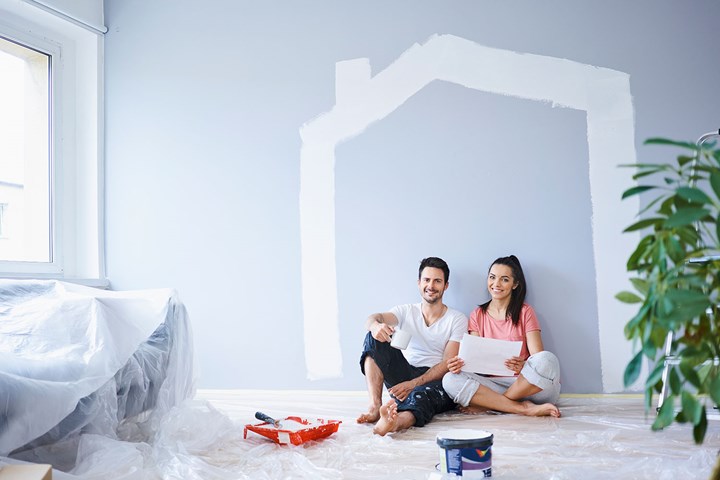 two people painting interior