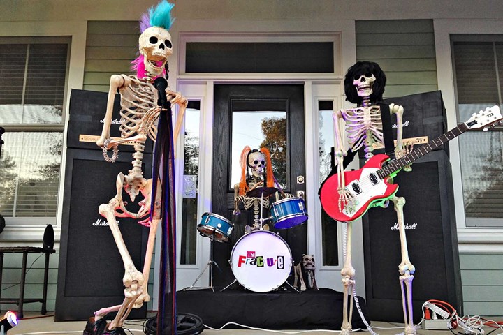 Funny Halloween skeletons posed as rock band