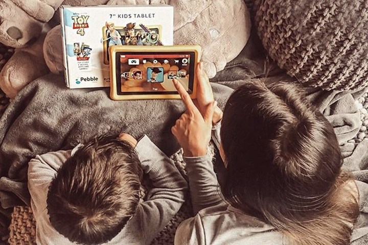 Kids playing Disney themed tablet