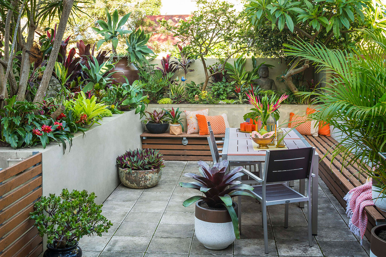 Small terraced house garden makeover using lush tropical plants | Better Homes and Gardens