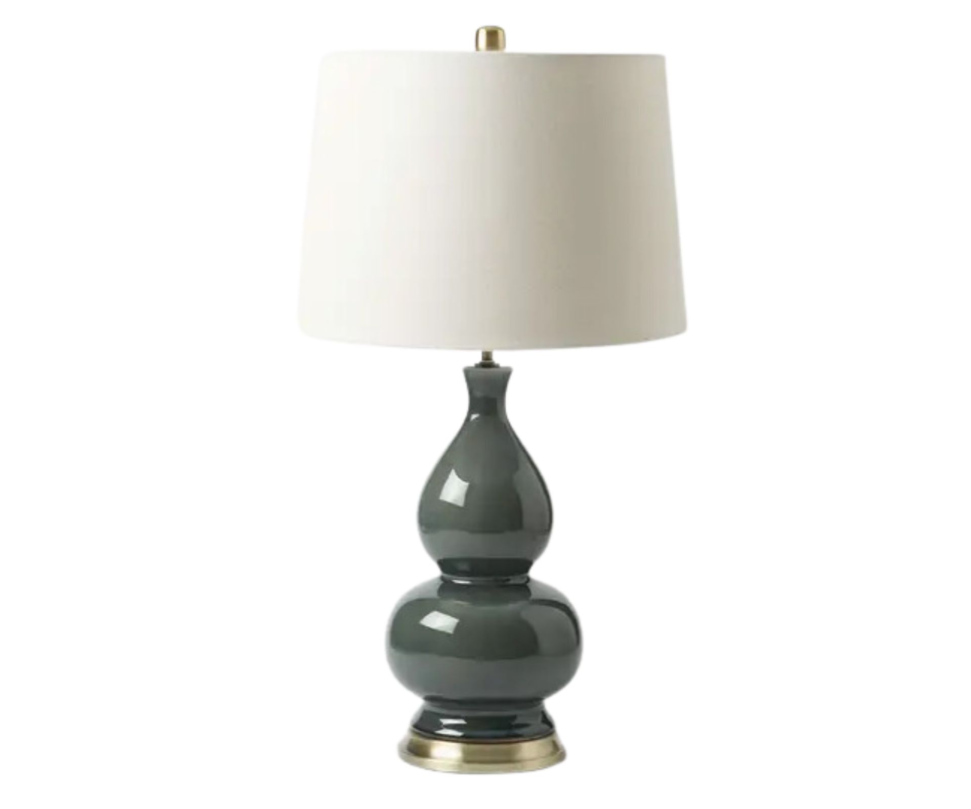 Green and gold ceramic table lamp with a white lamp shade