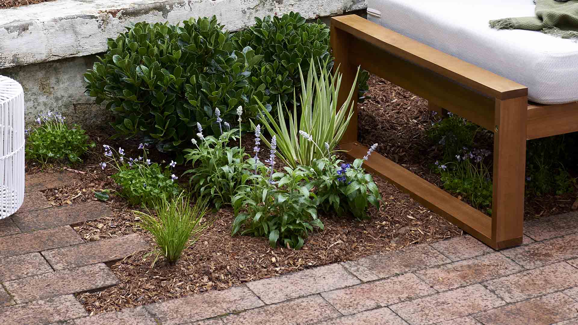 How to create a flower bed between brick courtyard pavers