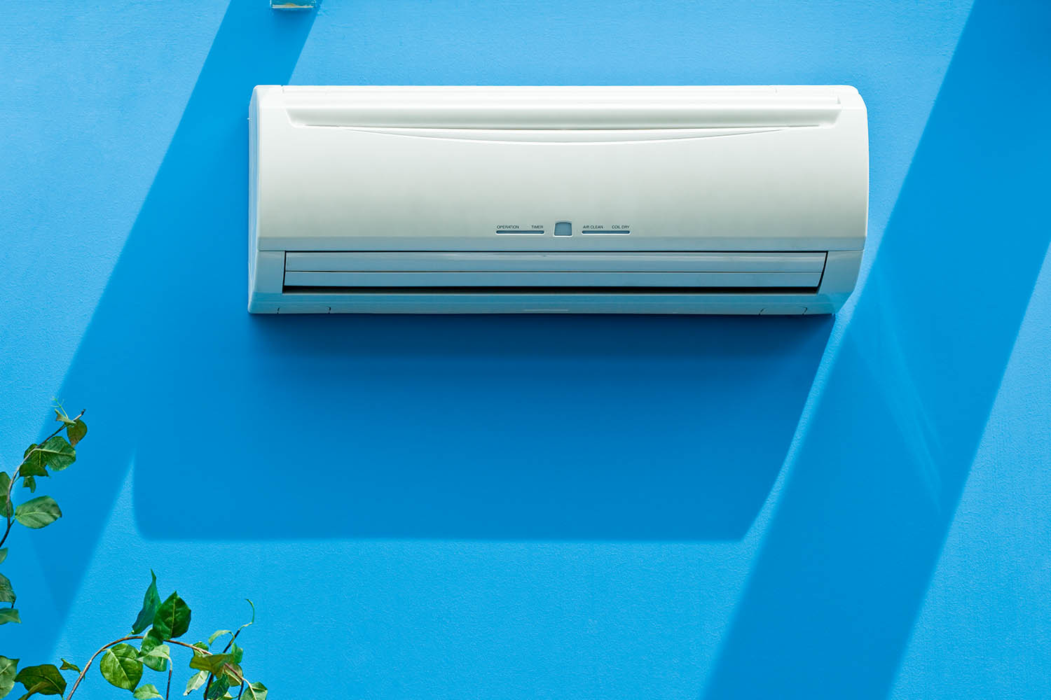 air-conditioning unit on blue wall