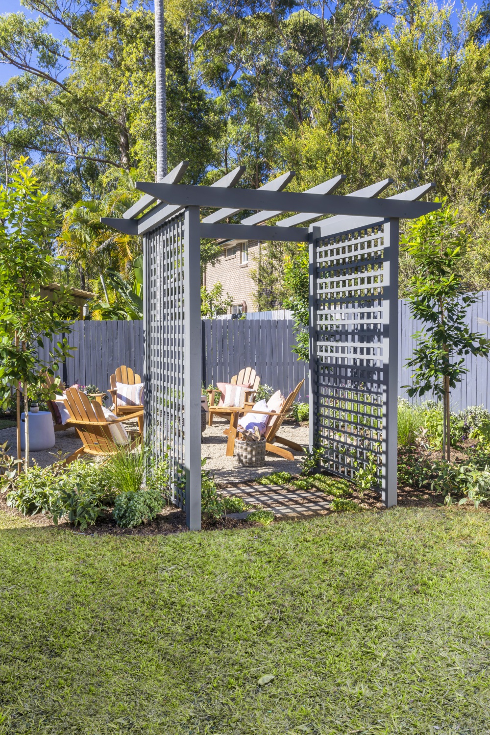 cheap backyard ideas after photo with arbour and seating area
